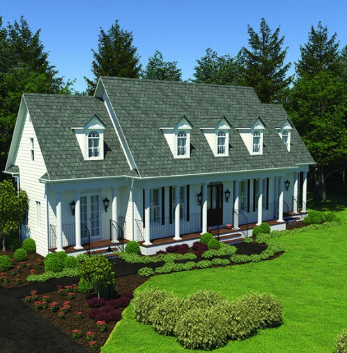 A beautiful whit home with large columns on the porch, and a new gray shingle roof.