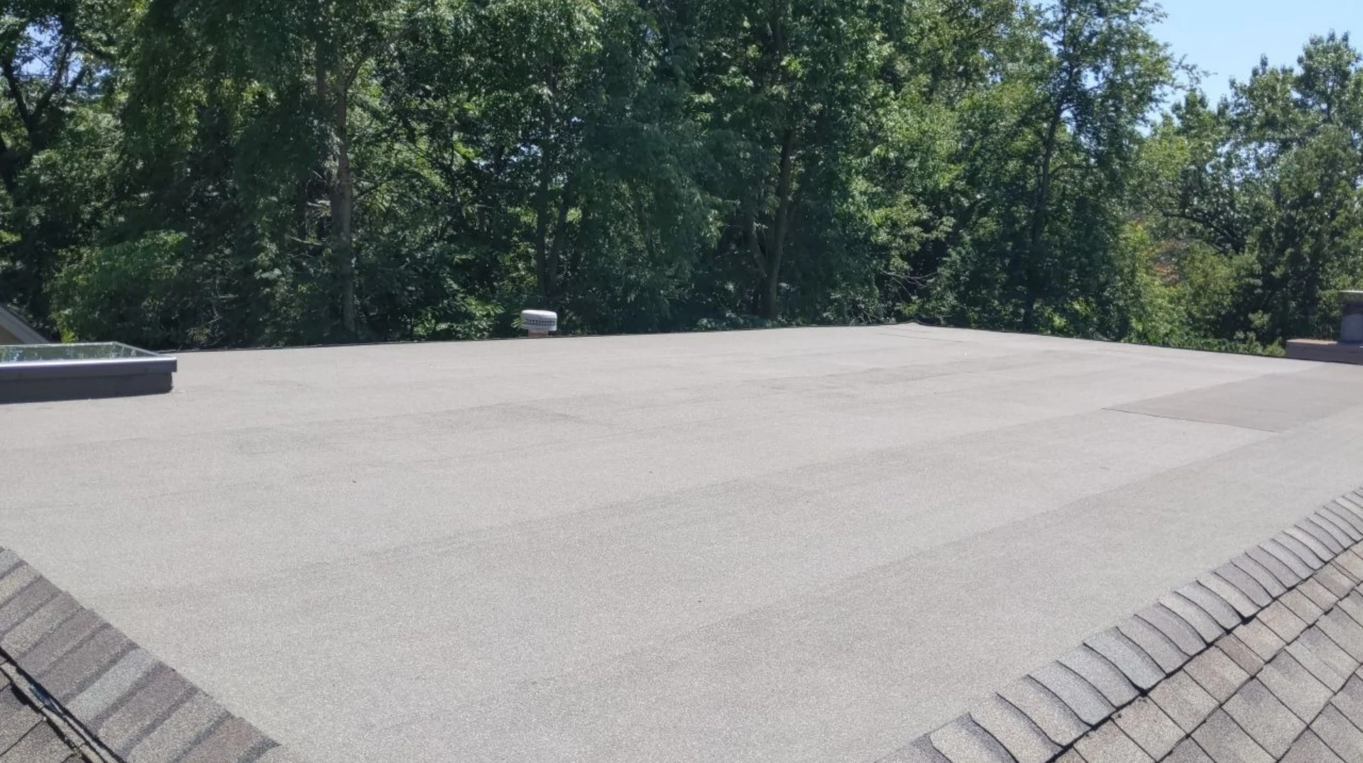 A view of a commercial flat roof from above.