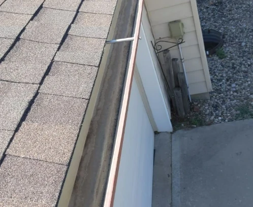 A close-up image of a new gutter system installed by Bill West Roofing on a home near Kansas City.