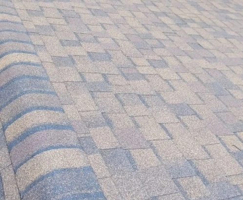 An asphalt shingle roof with a ridge vent.