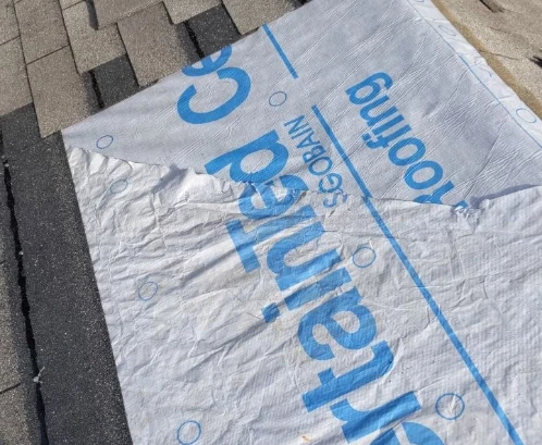 CertainTeed roofing underlayment being installed on a home.